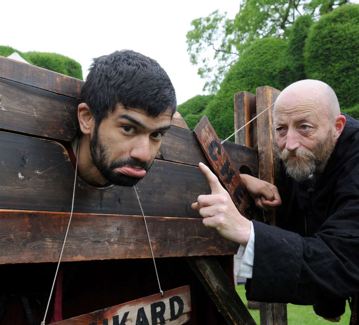 Who's a naughty boy - Bengor of Dover in the stocks with Father Merkin