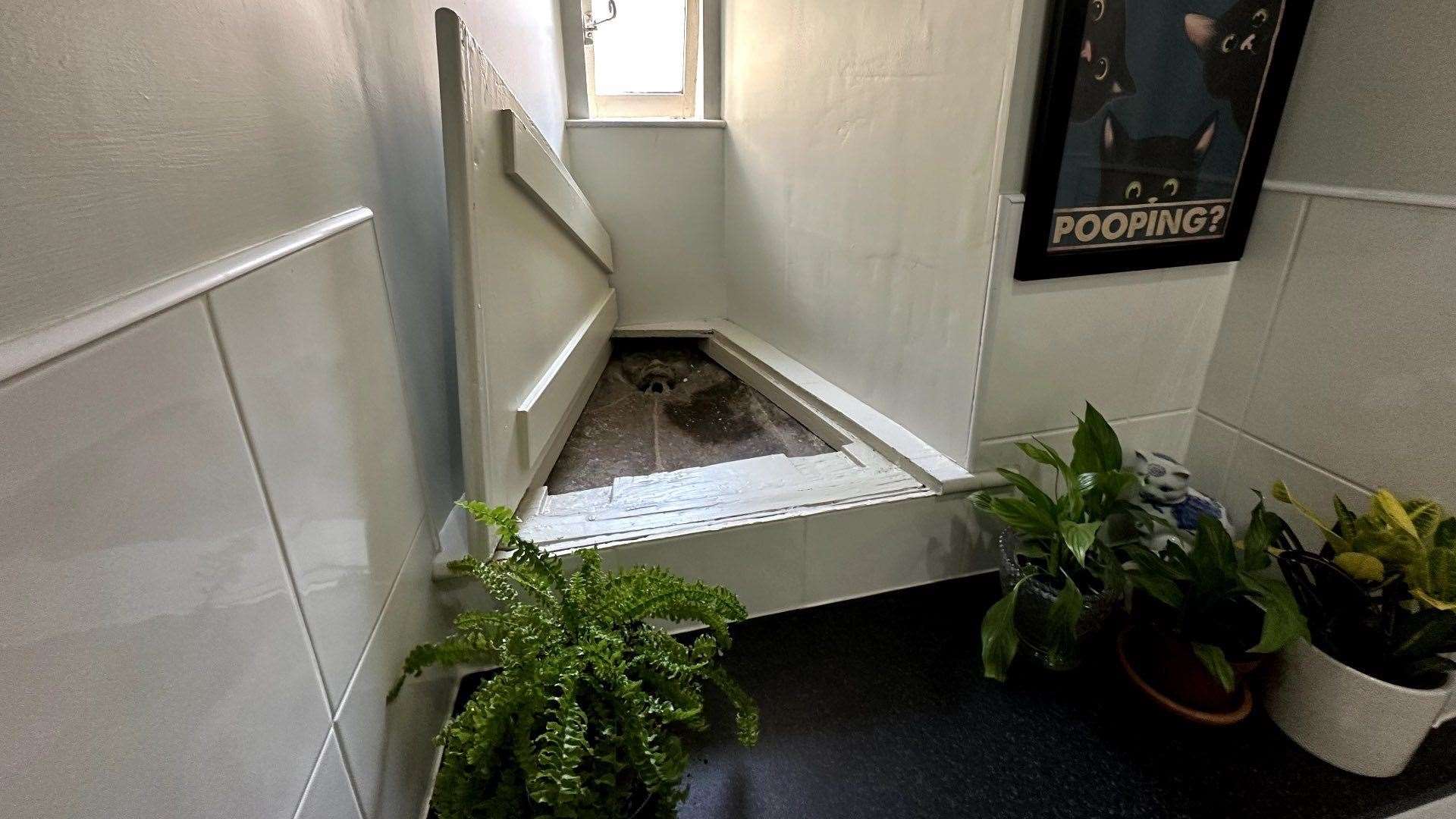 Rory spotted the drain hidden under this trapdoor