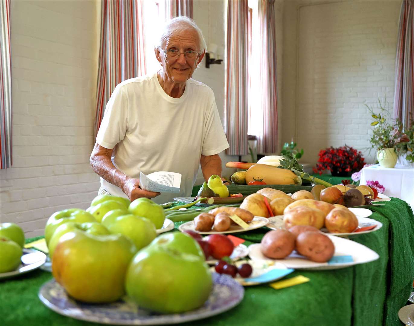 John Hewitt judges the fruit and vegetable entries