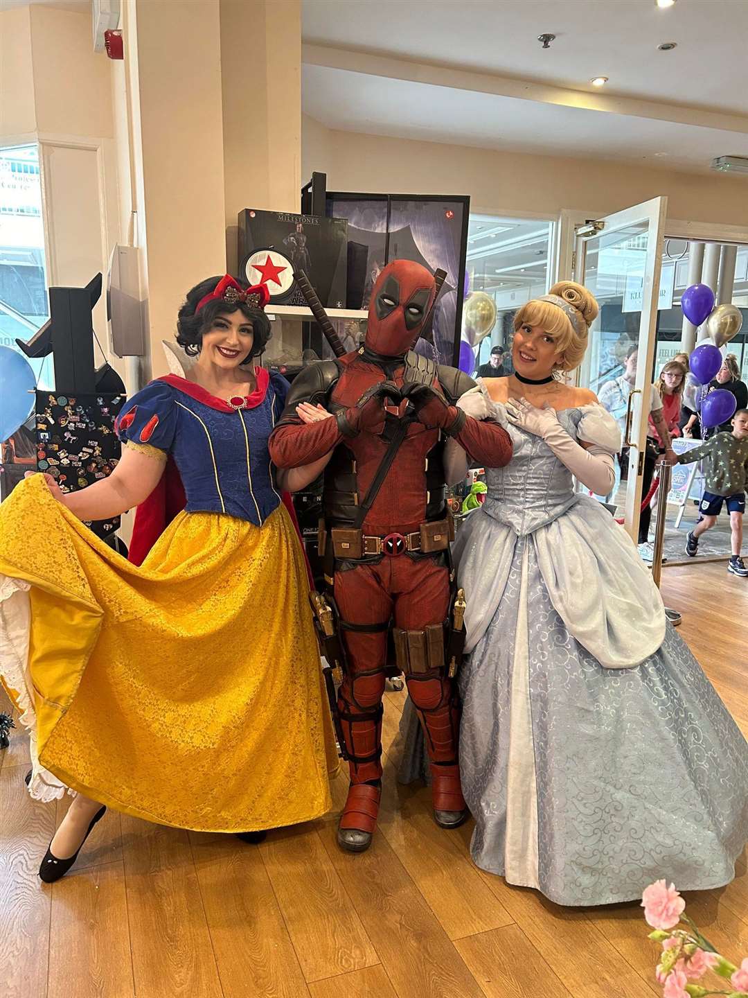 The princesses and Deadpool turned out for the opening.