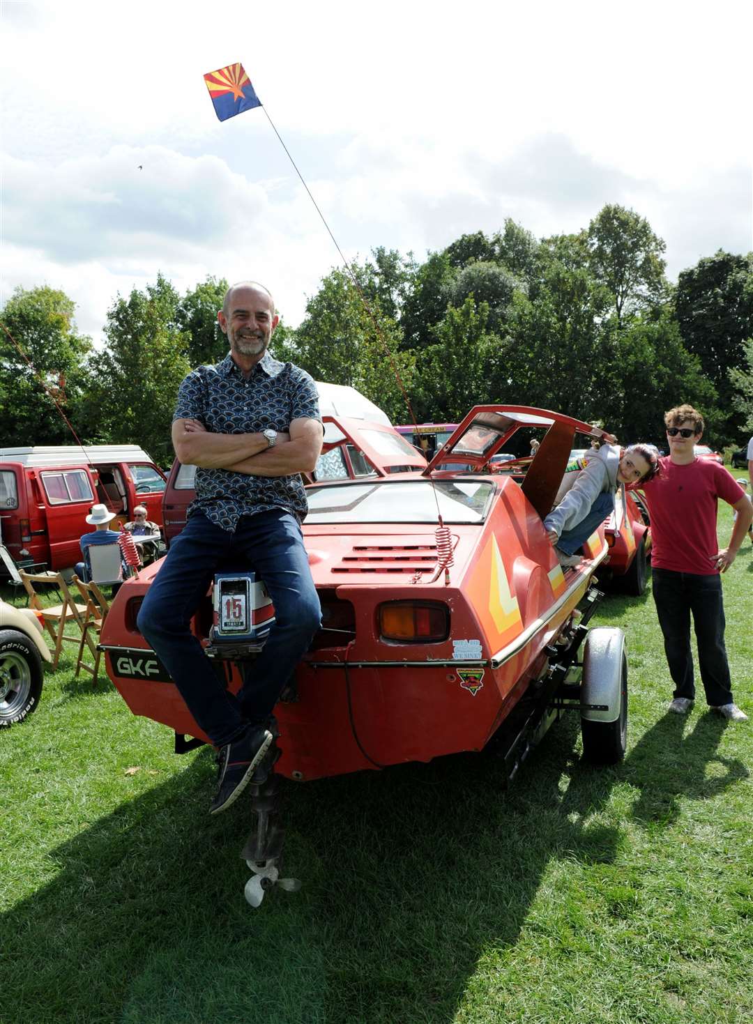 Ian Jeffries with children Eva and Isaac and car boat kit on trailer. Photo: Chris Lowndes