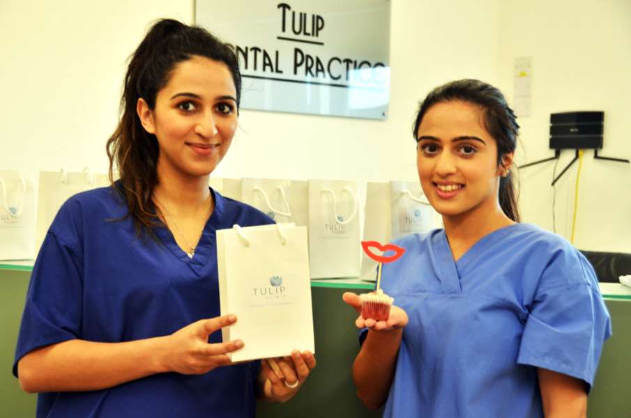 Rabhi Haseeb and Dr Almira Haseeb with complimentary bag and smiley cup cake on open day