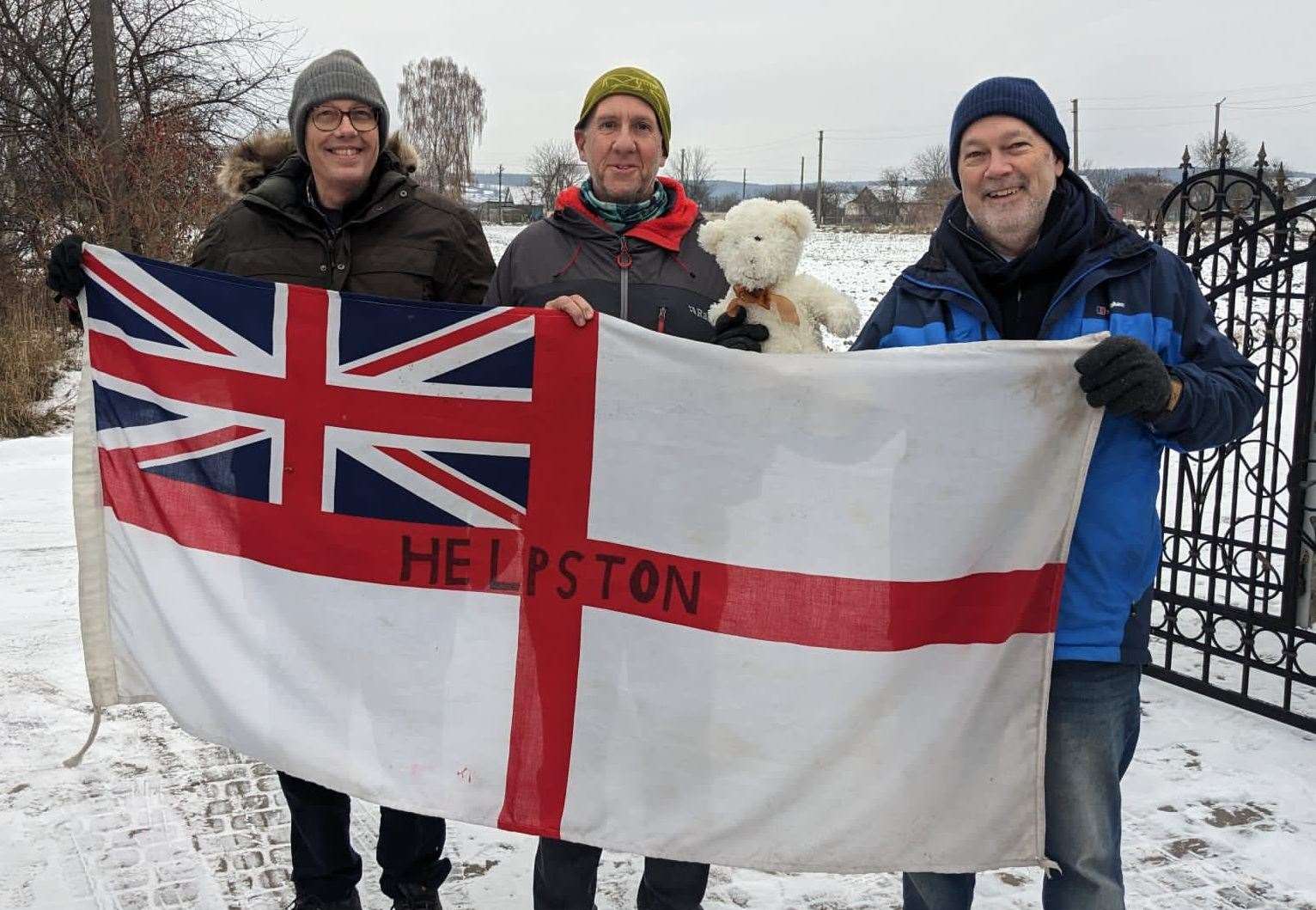 Richard Astle (centre) with fellow Helpston volunteers Bob Bennett and Neil Hammond and a teddy donated by St Augustine's Primary School in Stamford