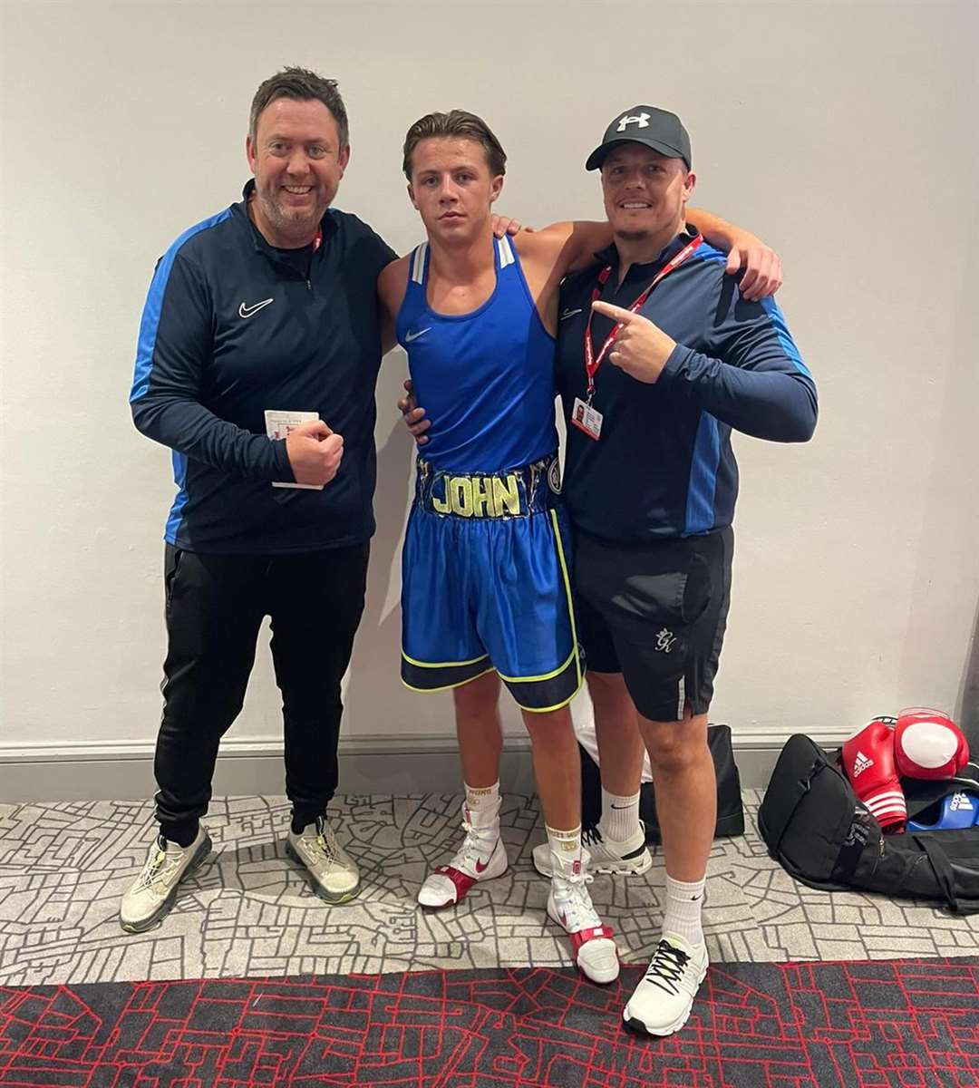 John Doe and his coaches from Stamford Boxing Club.