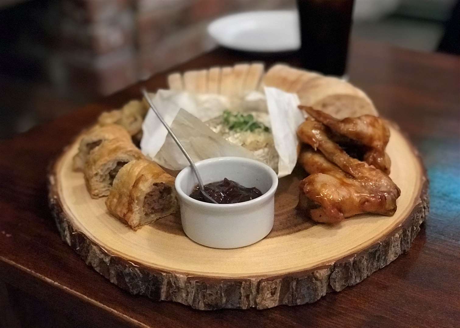 A platter of camembert, sausage rolls, chicken wings and the superb jalapeno poppers