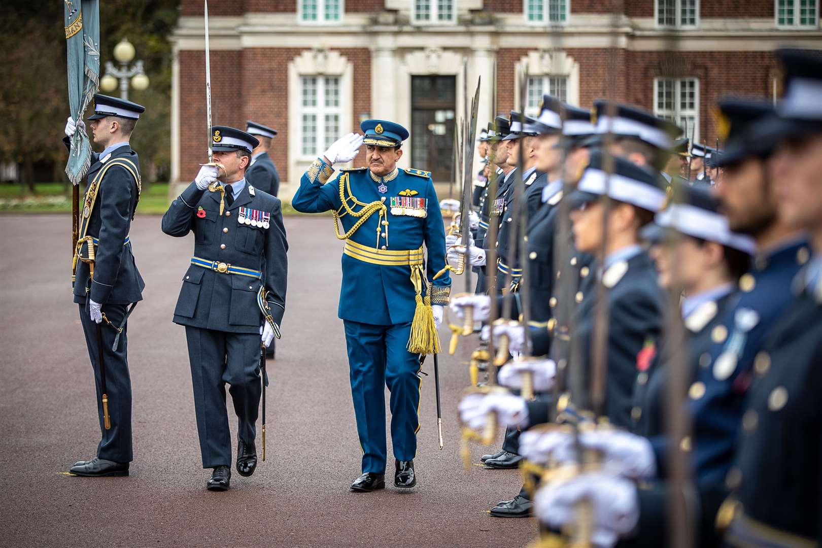 Air Vice-Marshal Al-Ghafri, saluting the Queen’s Colour of the Royal Air Force College in front of College Hall Officers’ Mess. (60439688)