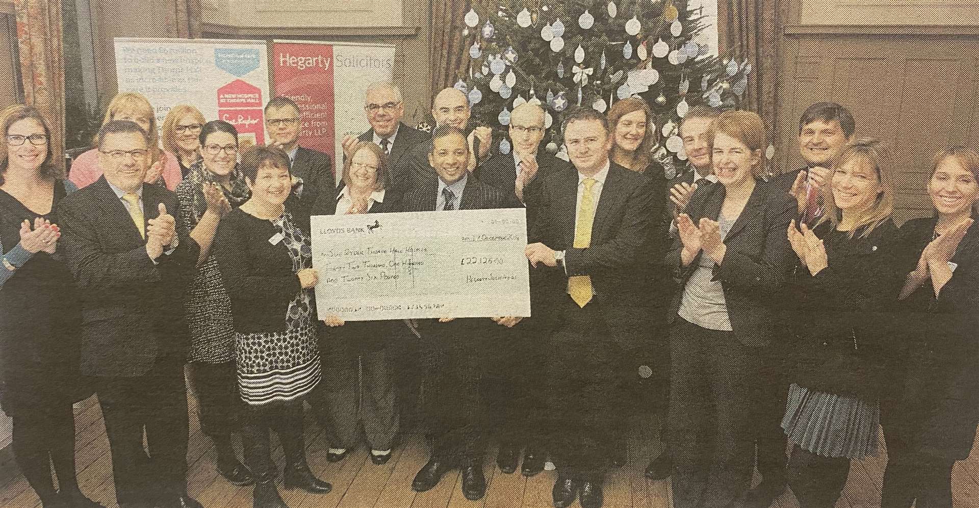 Hegarty partners and staff presenting a cheque for £22,126 to Thorpe Hall fundraisers 10 years ago.