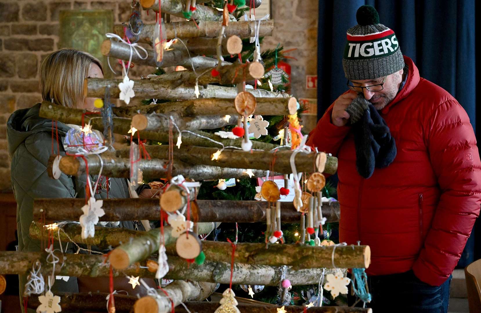 Visitors enjoying the St Wulfram's Christmas Tree Festival and skating rink.