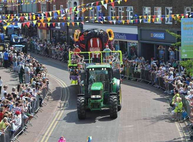 Floats weave their way through crowded streets