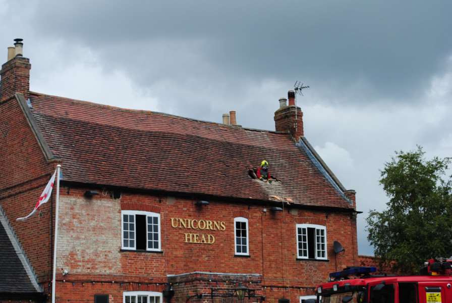 Firefighters had to make holes in the roof to tackle the fire at the Unicorn's Head pub in Langar. Photo: 0337A