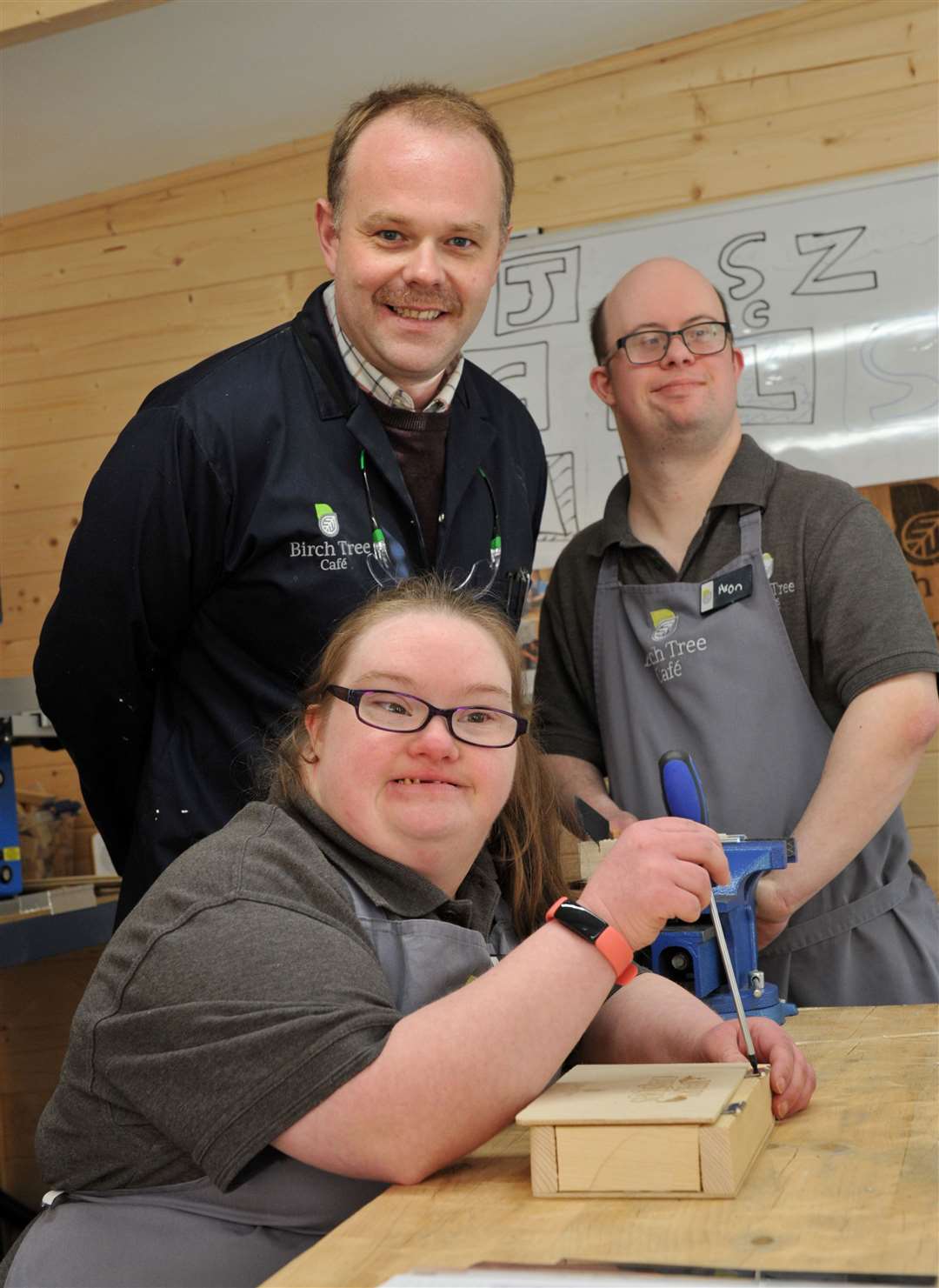 Workshop manager Lee O'Connor with some of the young people who work at Birch Tree Cafe