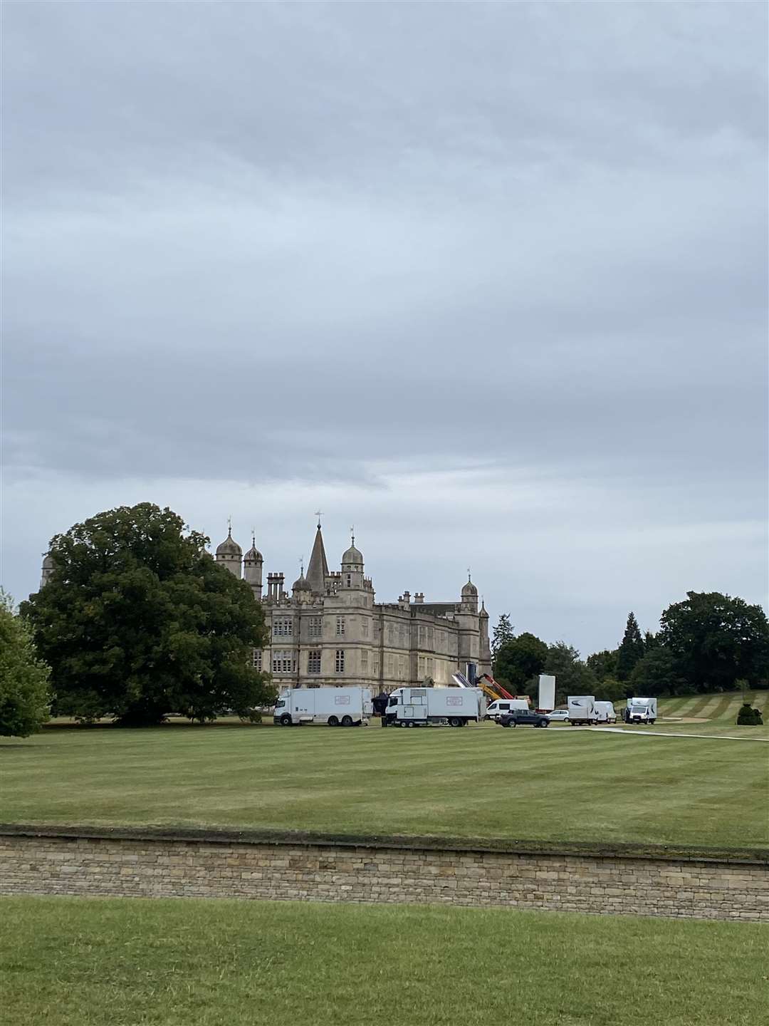 Television crews setting up for filming The Crown at Burghley House