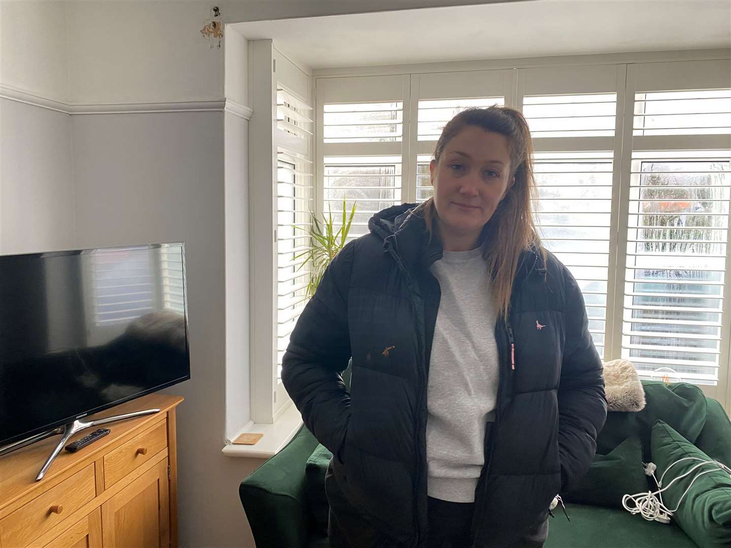 Emma Woolley has had to tell her daughter that the house is 'poorly' and needs to be 'fixed' before they can go back home.