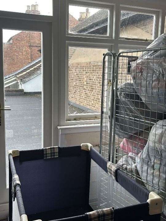 A smashed window at Sense’s charity shop in Spalding CREDIT Sense