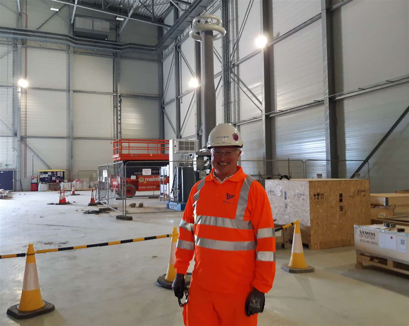 Senior project manager Phil Spain in front of a Sealing Cable in one of the halls at the Viking Link interconnector