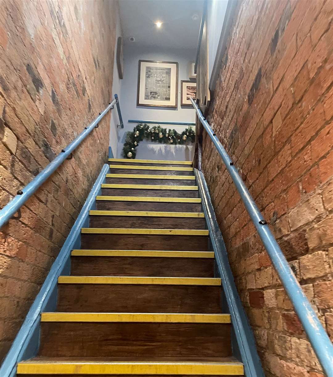 The stairs to the toilets