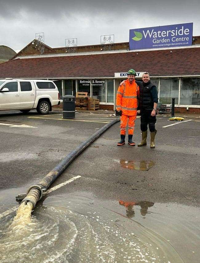 Staff pumping water from Waterside Garden Centre with machinery from construction company Breedon