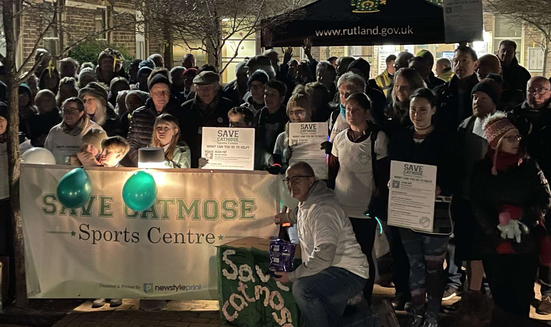 Protesters gather ahead of a meeting to discuss the future of Catmose Sports Centre