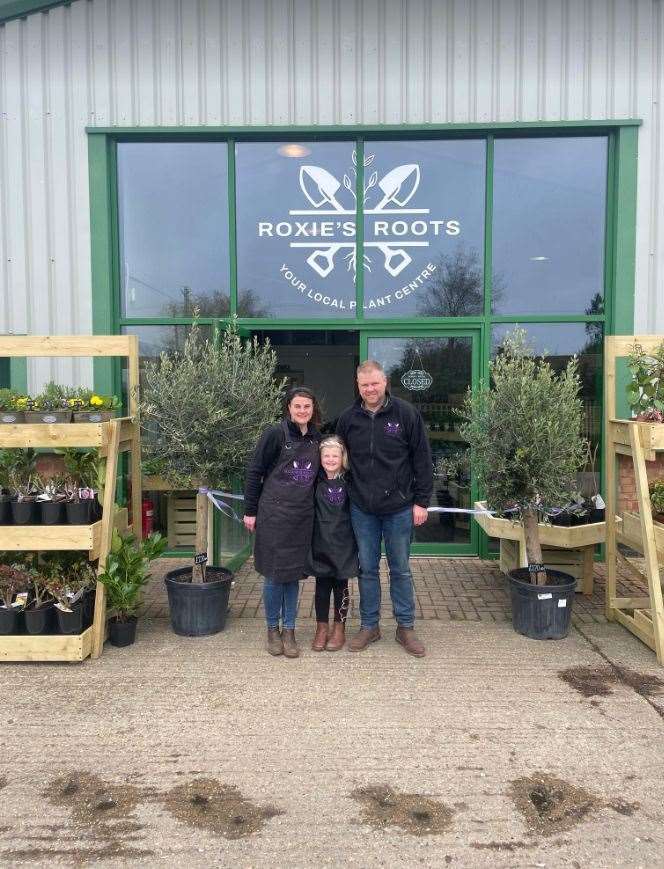 Kelly and Sam Matthews with their daughter Roxie in front of their new garden centre Roxie's Roots