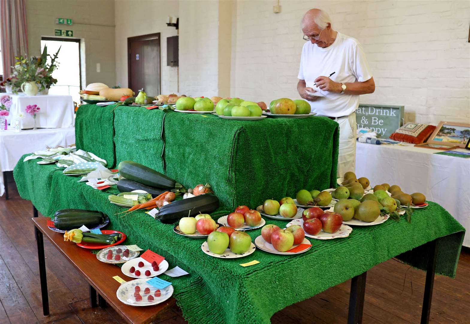 John Hewitt judges the fruit and vegetable entries