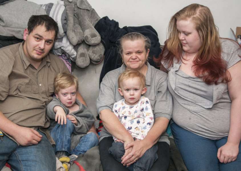 Connor Cowling, 23, and Sophie Haymes, 21 at home in Potters Close, Bourne, with children Braiden, 4, Sapphire, 18 months and Sophie's mum Ellie Haymes. ALL PHOTOS: LEE HELLWING