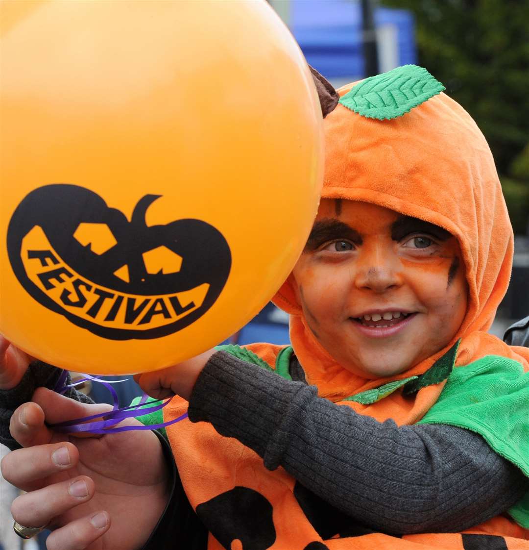 Carter Stockwell, 3, gets into the spirit of the Pumpkin Festival