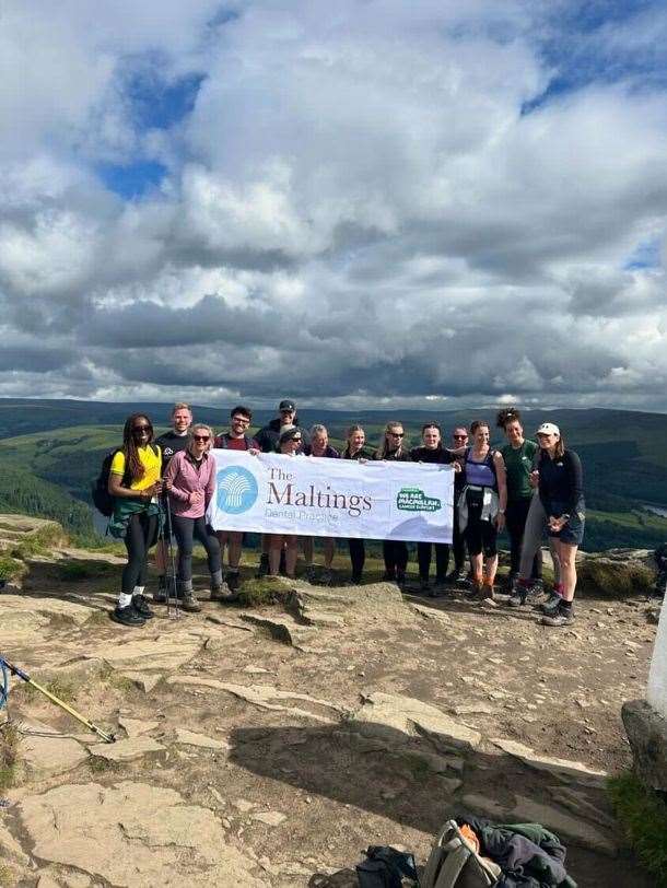 The team on top of the world in the Peak District.