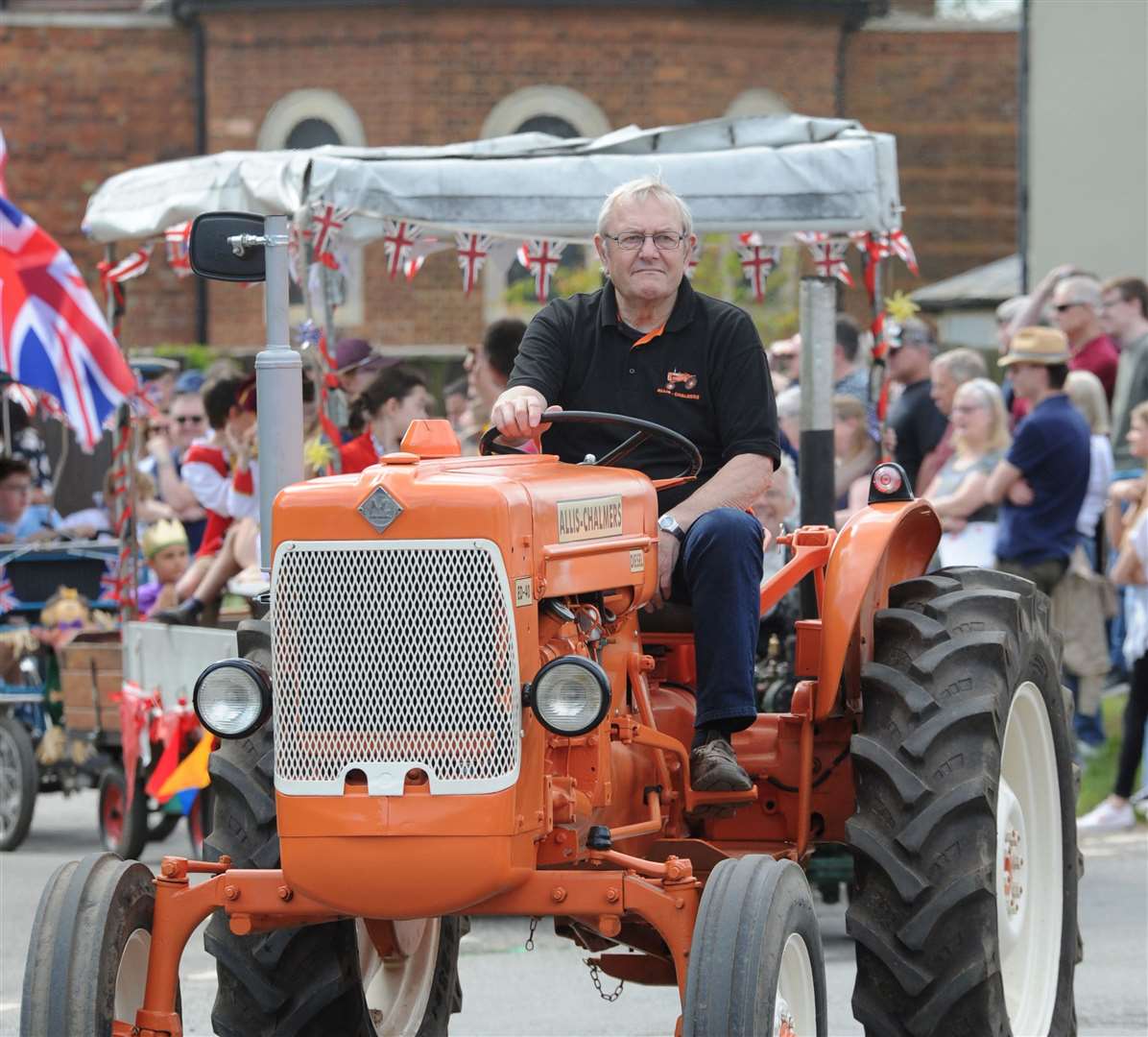 A tractor leads the way