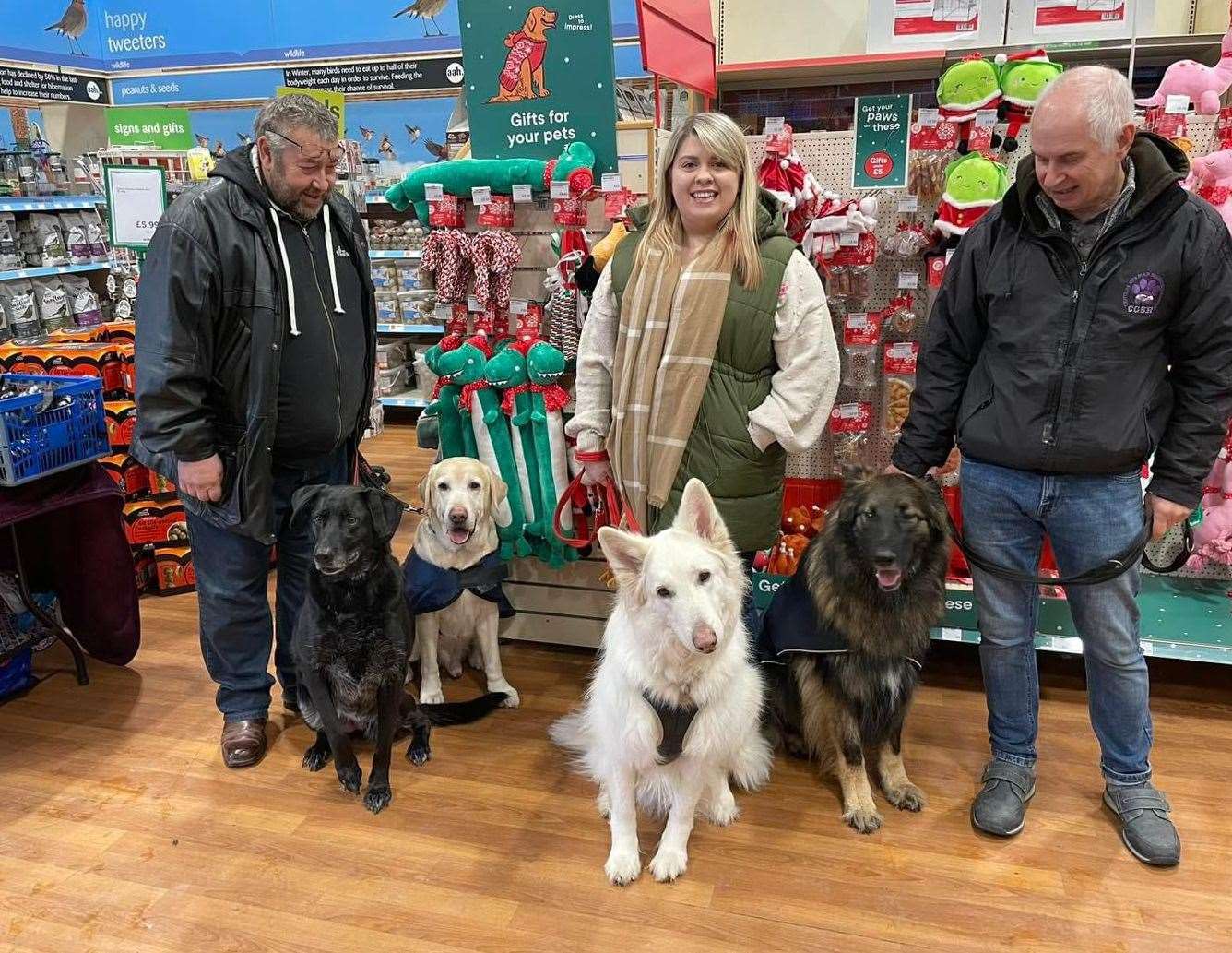 Bea, George, Misti and Jax at a Christmas fundraising event with volunteers Mick, Emily and Steve