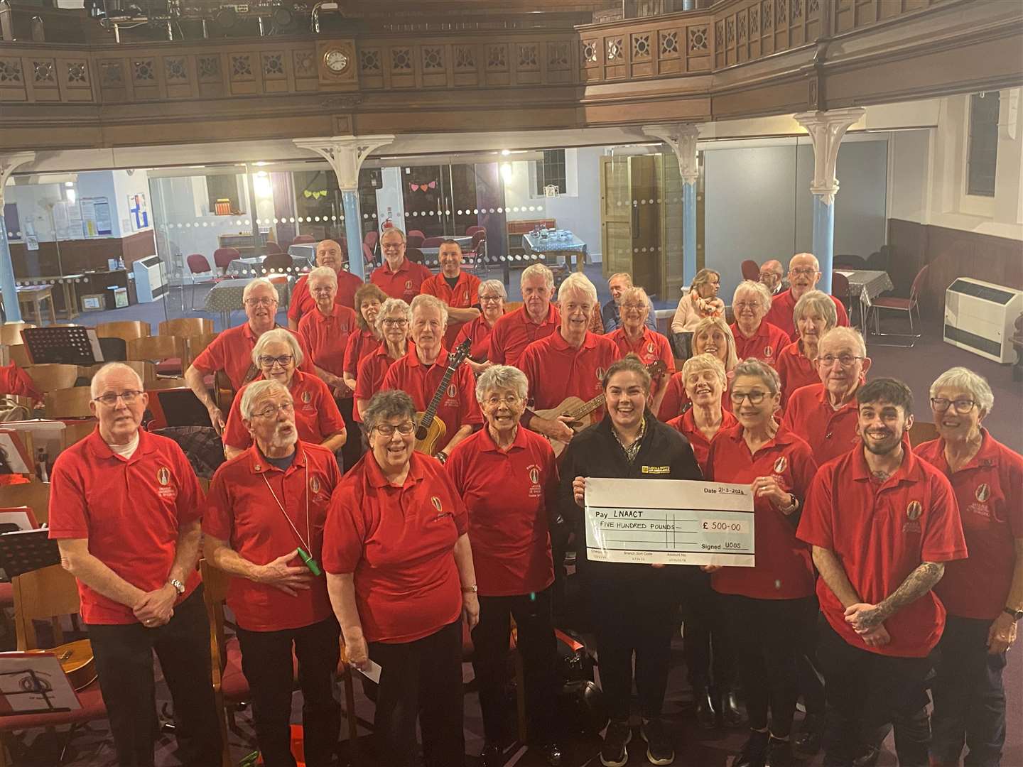 The Ukulele Orchestra of Spalding have handed £500 over to the Lincs & Notts Air Ambulance