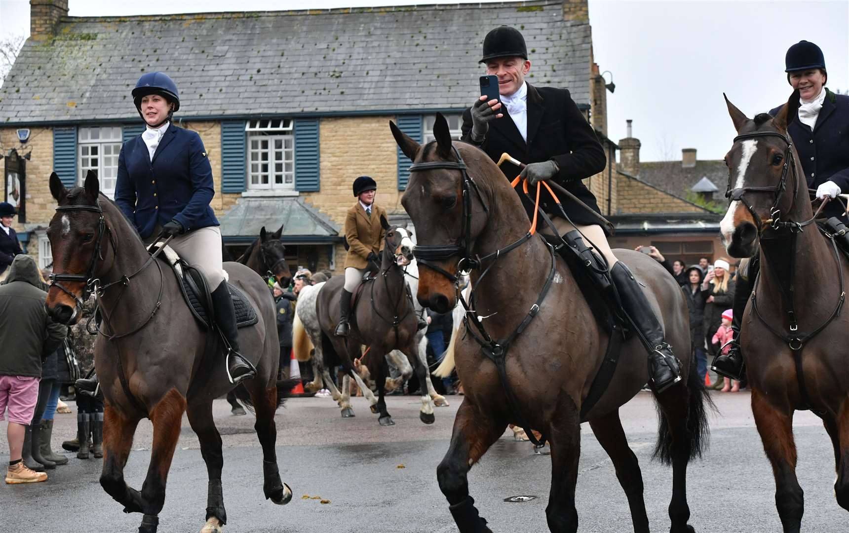 Hounds and riders arriving in the village for the Fitzwilliam Hunt New Year's Day meet. Photo: David Lowndes