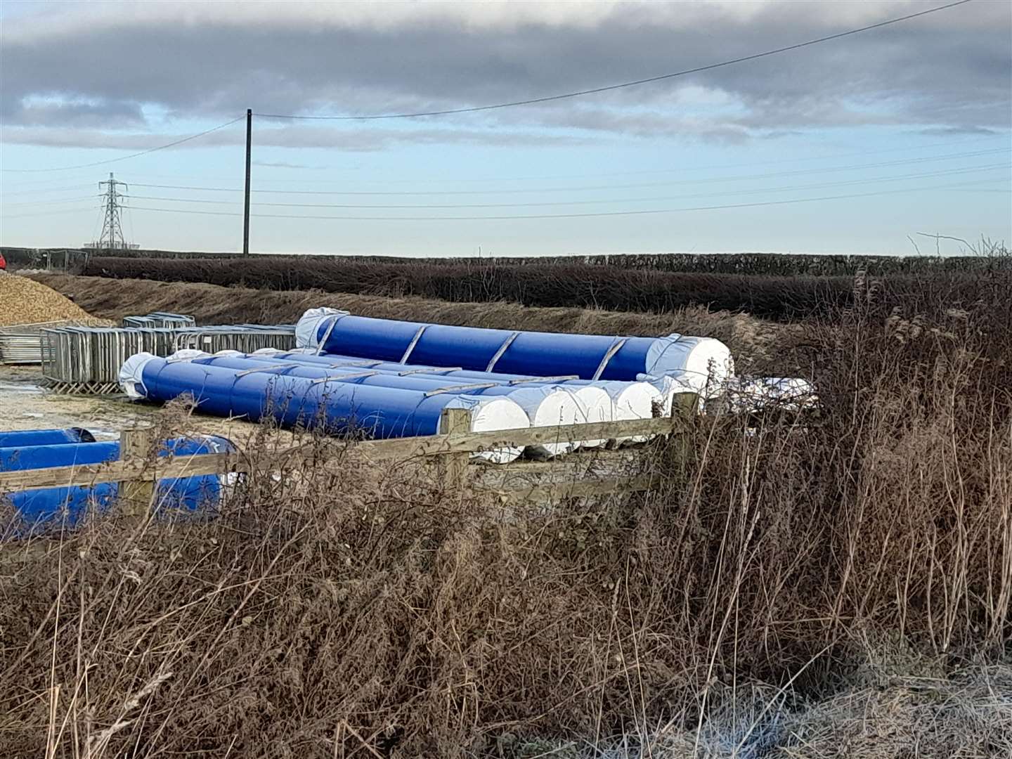 Dozens of pipes for delayed Anglian Water project, stored off Wragby Road in Lincoln - and there are similar scenes in Greatford and Glinton