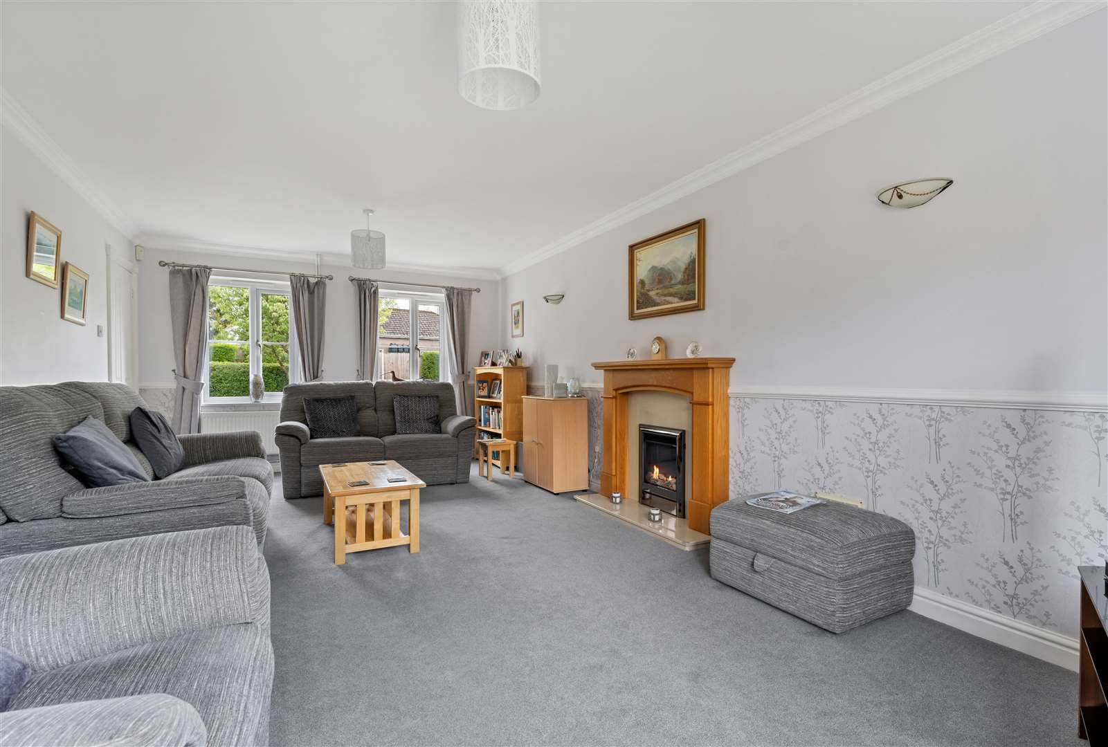 The living room runs from the front to the back of the property