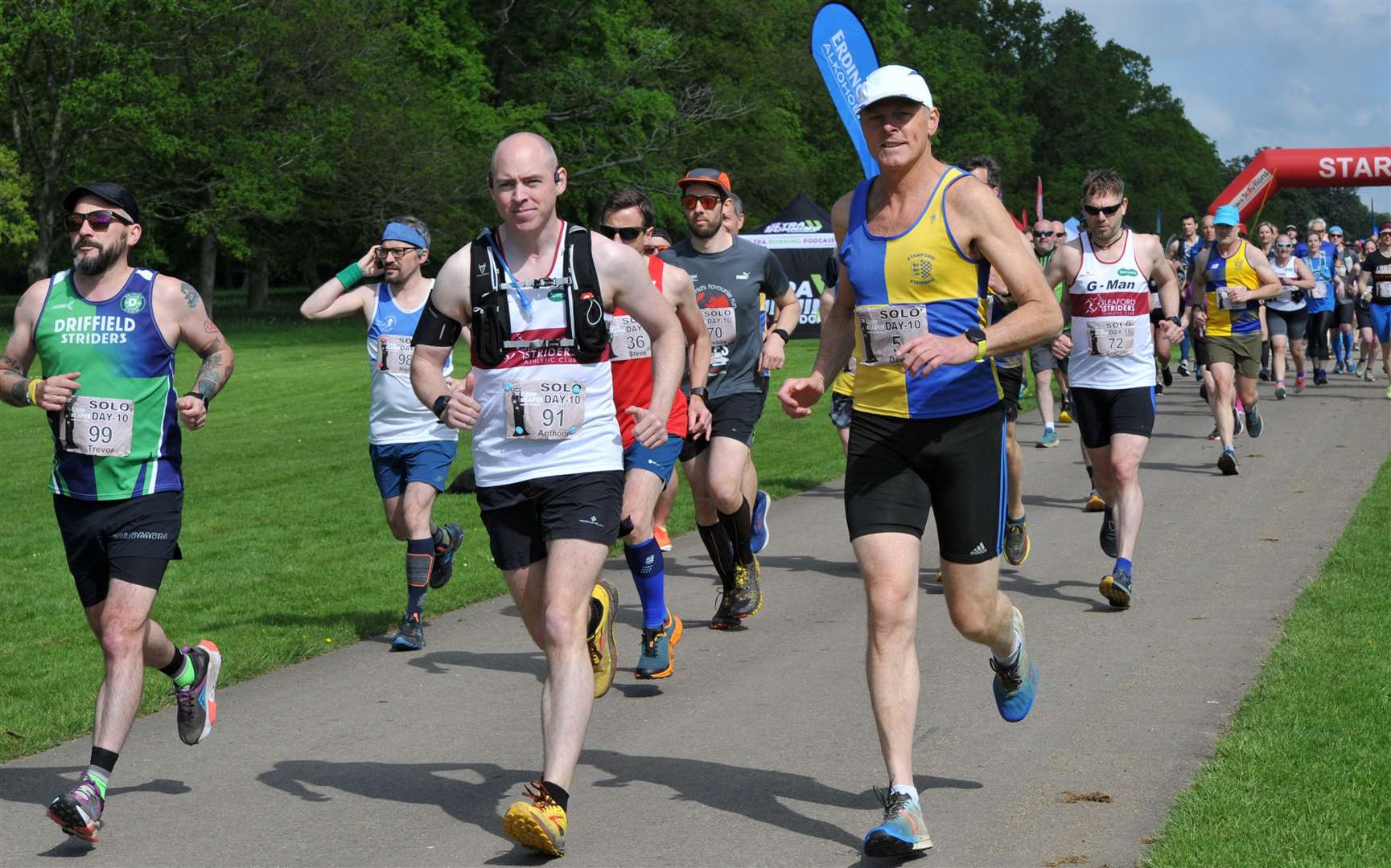 David Babbs (10 mile) in white cap, first Strider