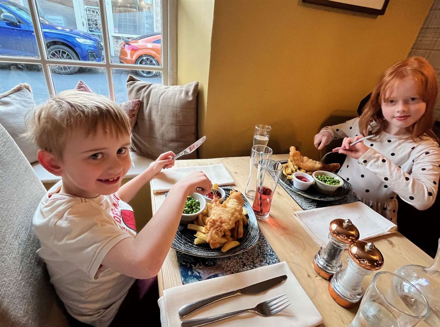 Isla and Rory tuck into their fish and chips at the Red Lion, Caythorpe.