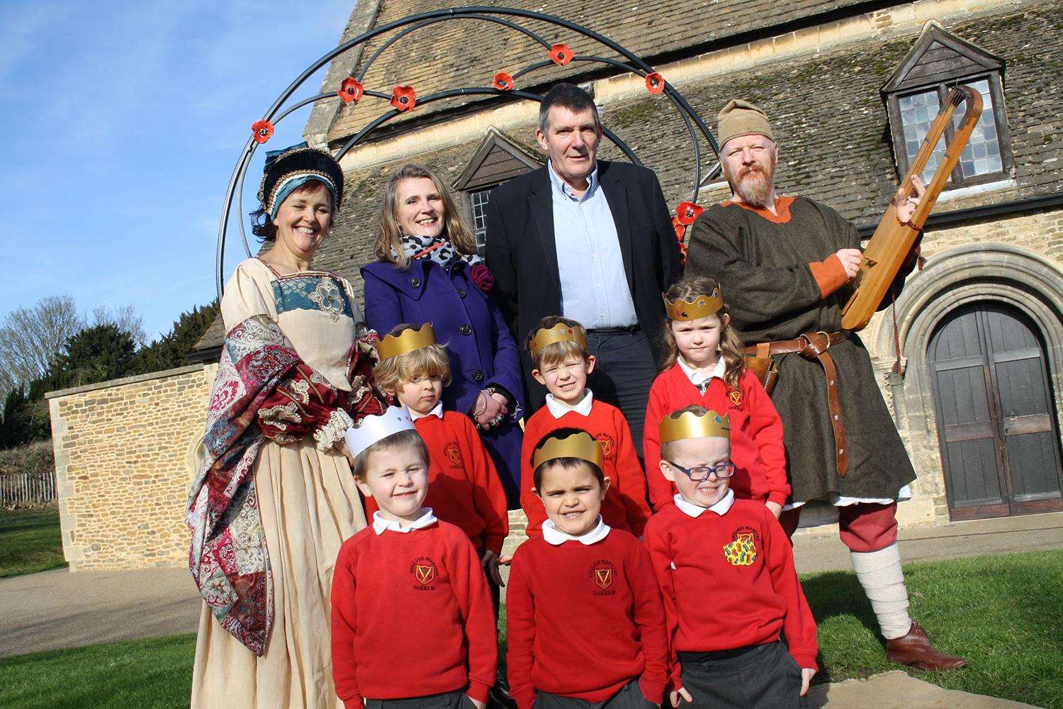 Council leader Oliver Hemsley and cabinet member for culture and leisure Lucy Stephenson with children from English Martyrs academy at Oakham Castle