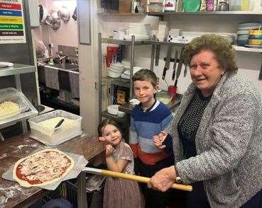 It's a family affair with from left to right: Poppy (4), William (9) with Dawn Ladbrook (84) their great nan who made pizzas for the first time. PHOTO: SUBMITTED