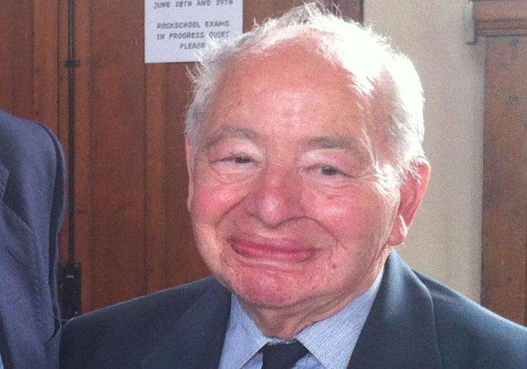 Colin Dexter (right) receiving Honorary Life Membership of the Old Stamfordian Club from club chairman Ian Plant.