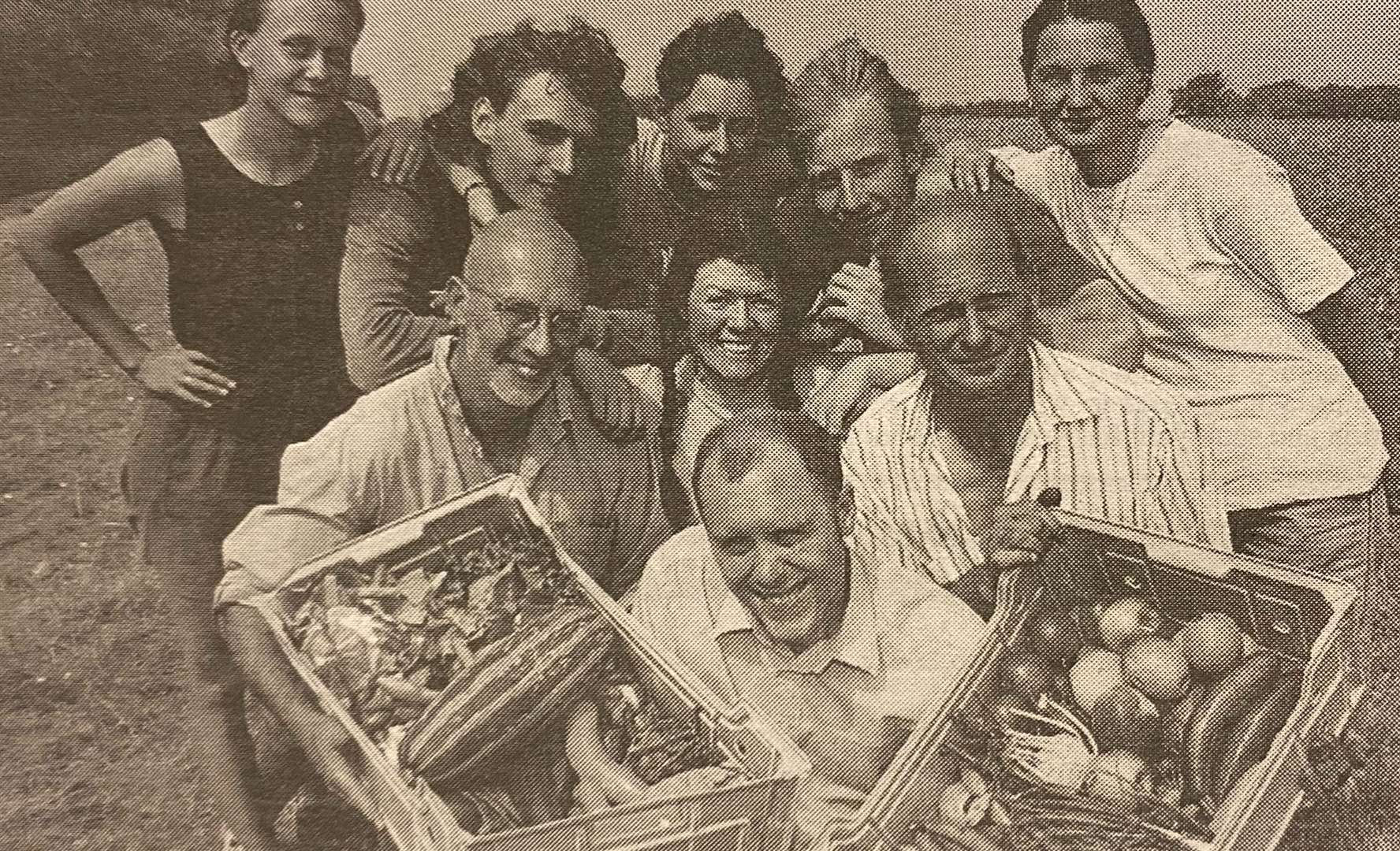 Will Tomkinss, Clive Ibotson and a group of farm workers show off their mighty veg 25 years ago.