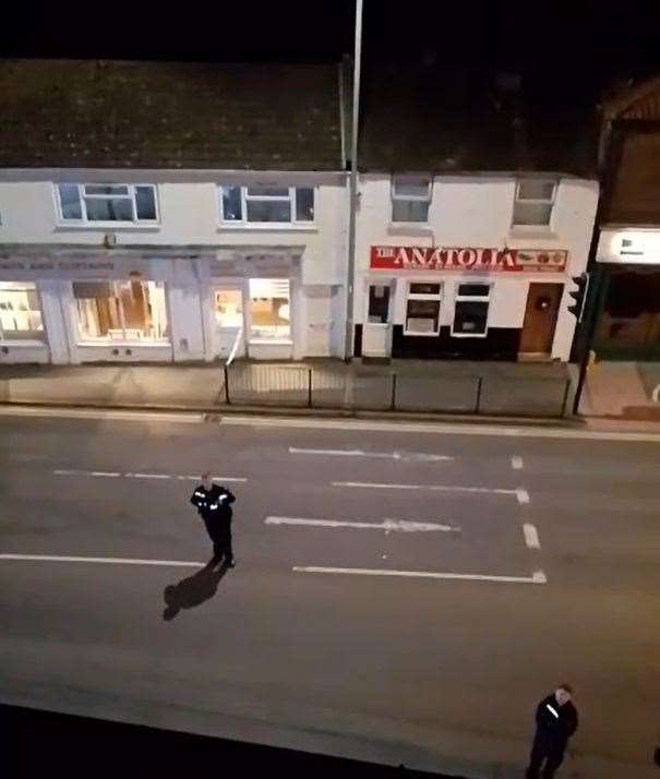 Footage live-streamed to Facebook showed a man on top of a shop roof on Gaywood's Lynn Road. Picture: Facebook
