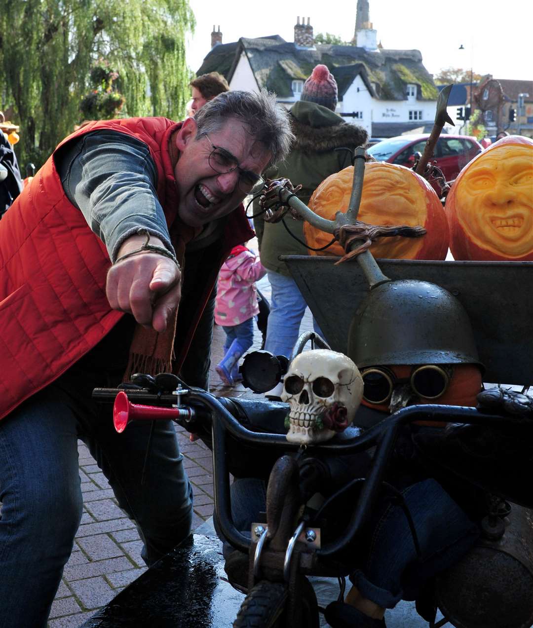 Artist Jonathan Nichols with some of his pumpkin statues