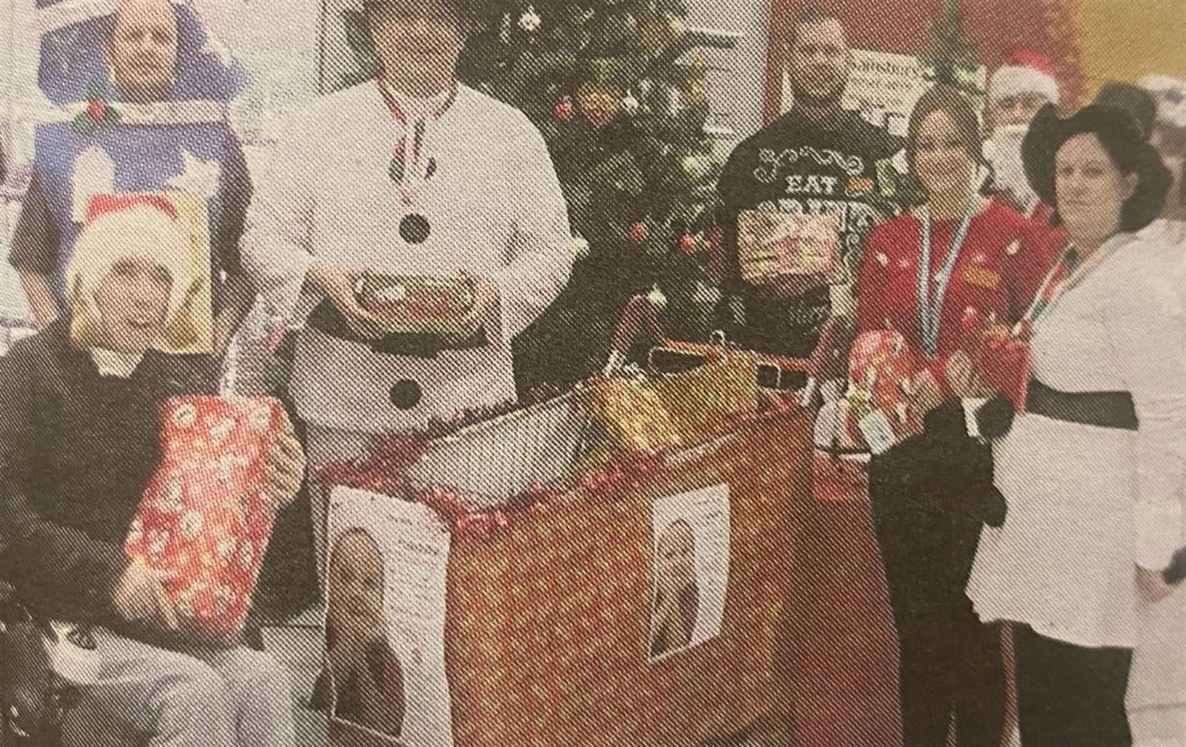 Stamford St Martin's Rotarians collect presents from Sainsbury's 10 years ago.