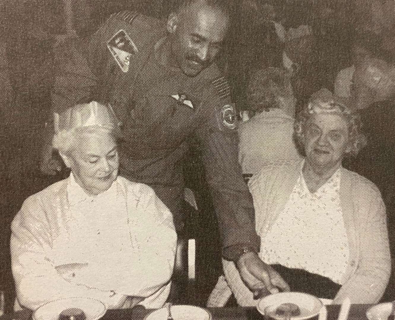 Gp Capt Andre Dezonie swoops in to serve Betty Smith from Wansford 25 years ago.