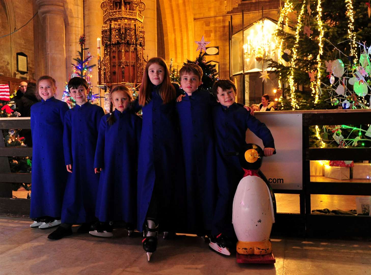 Choir members next to the church's ice rink.