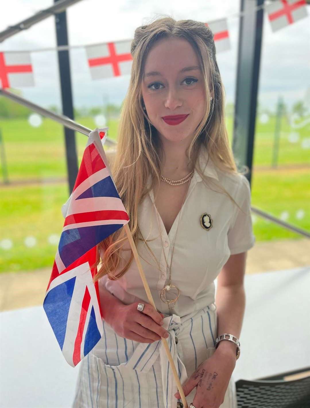 A Deepings School sixth former with a flag