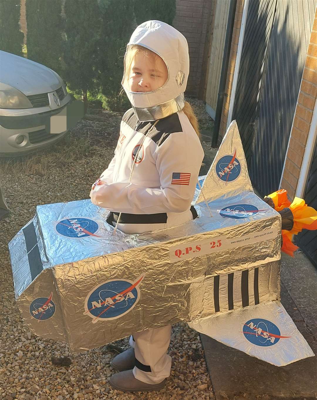Eden Armstrong-Taylor, nine, a pupil at Quadring Primary as Neil Armstrong. She has been reading the book The Life of Neil Armstrong