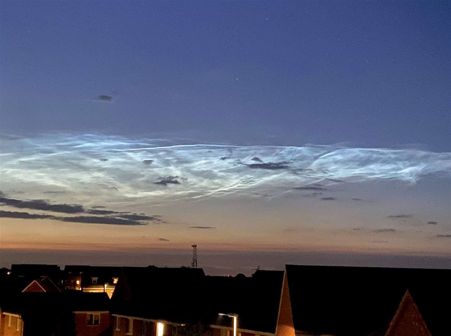 The noctilucent cloud seen in the sky above Bourne