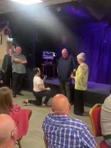 Sarah Perry proposing to Nick Wiles.