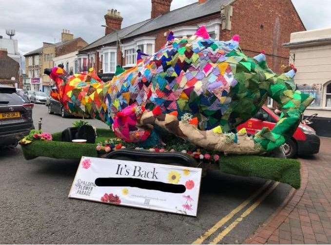 A smoke-breathing dragon visited Market Place in Spalding. PHOTO: SUBMITTED Spalding Flower Parade CIC (Group)