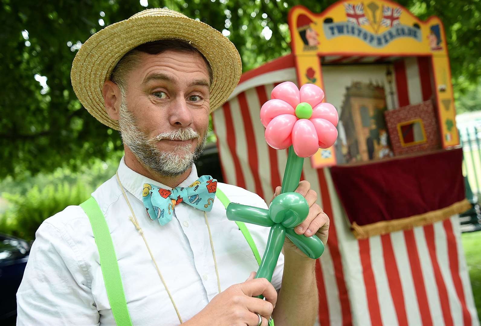 Rob Driscoll shows off his balloon made into a flower.